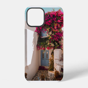 FUNDA PARA iPhone 12 PLANTA ROSA Y VERDE EN PARED DE HORMIGÓN BLANCO