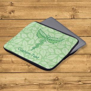 Funda para portátil con caduceo y hojas de fondo