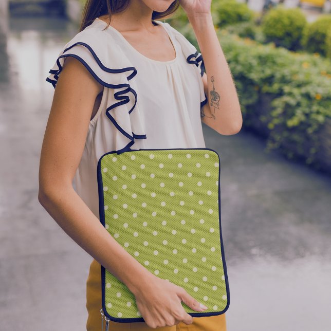 Funda Para Portátil Dotty Delight Green (A woman is standing with a laptop in a Dotty Delight Green Laptop Sleeve.)