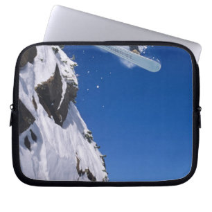 Funda Para Portátil Hombre en una snowboard saltando desde una cornisa