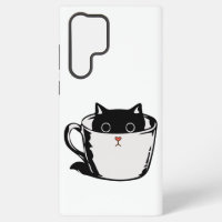 Gatito negro con nariz roja escondido en una taza