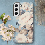 Funda Para Samsung Galaxy S22  Rosas blancas en fondo azul rústico con monograma<br><div class="desc">Exuberantes rosas blancas y flores silvestres sobre un fondo rústico azul. Campo de texto opcional para su monograma o inicial.</div>