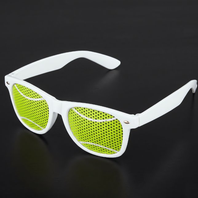 Gafas de sol divertidas para fiestas de tenistas (Tennis ball sunglasses on black table. Great for tennis parties and events!)