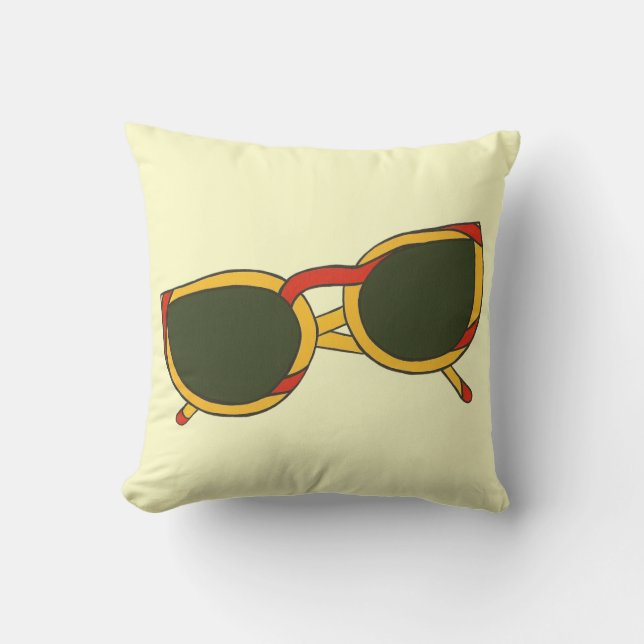 Gafas de sol en la almohada amarilla y roja (Anverso)