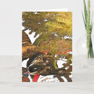 Galgo debajo del árbol de navidad