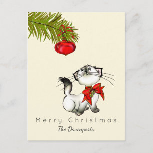 Gatito juguetón del navidad con un arco rojo