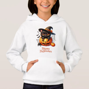 Gatito negro en una calabaza de Halloween