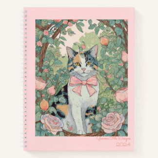 gato calico en cuaderno en espiral de jardín