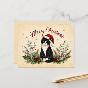 Gato de esmoquin con sombrero de Santa en Navidad