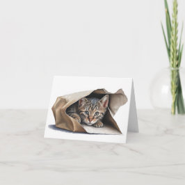 Gato de tabla en la bolsa de papel