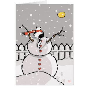 Gato de vacaciones sentado en la noche de Snowman 