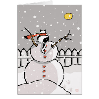 Gato de vacaciones sentado en la noche de Snowman 