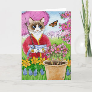 Gato lindo en tarjeta de felicitación japonesa del