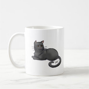 Gato negro y taza de gato plateado
