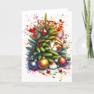 Gato oculto detrás del árbol de Navidad