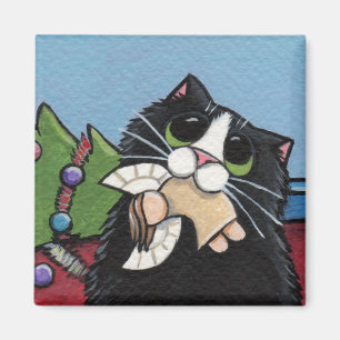 Gato travieso en el imán del navidad