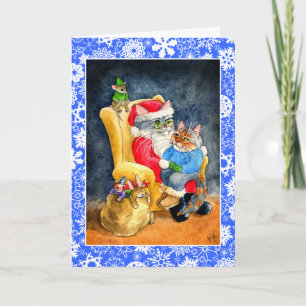 Gato y tarjeta del navidad o del día de fiesta de