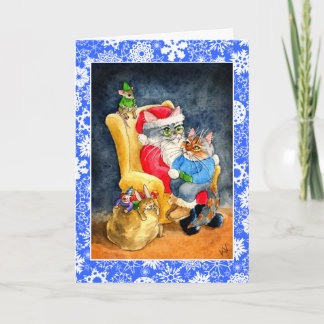 Gato y tarjeta del navidad o del día de fiesta de