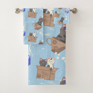 Gatos en caja y gotas de leche en azul