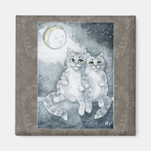 Gatos lindos en imán del claro de luna