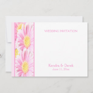 Gerberas rosadas sobre la invitación a la boda bla