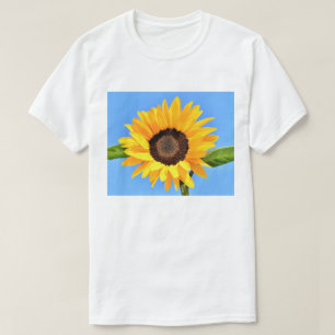 Girasol contra el sol en el cielo azul - camiseta 