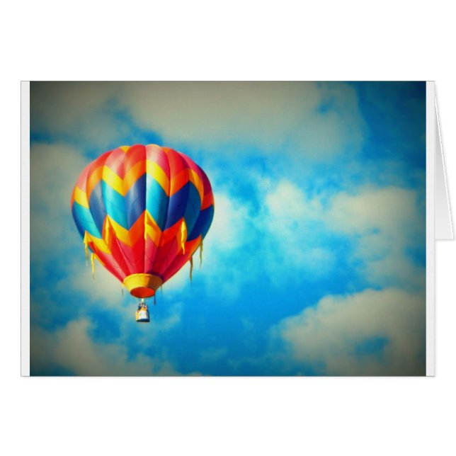 Globo de aire caliente flotando en el cielo azul (Anverso (Horizontal))