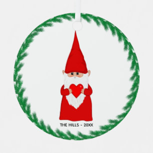 Gnome navidades sostiene un ornamento Metalizado c