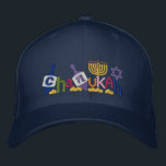 Gorra Bordada Letras de Chanukah<br><div class="desc">Texto de las características del diseño de Jánuca hecho de dreidel,  de Menorah,  de la estrella de David y de monedas de oro.</div>