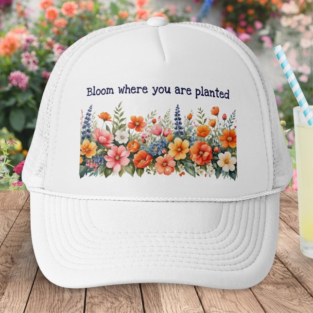 Gorra De Camionero Bloom Donde Se Plantan Flores (A baseball cap for gardeners with colorful floral design and caption 'Bloom where you are planted')