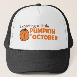 Gorra De Camionero Contando con una pequeña calabaza en octubre