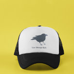 Gorra De Camionero Ilustracion de pájaro negro personalizado<br><div class="desc">Agregue un nombre o su propio lema para crear un gorra personalizado. Este gorra presenta un ilustracion de estilo realista de un cuervo con el texto debajo del gráfico de pájaro.</div>