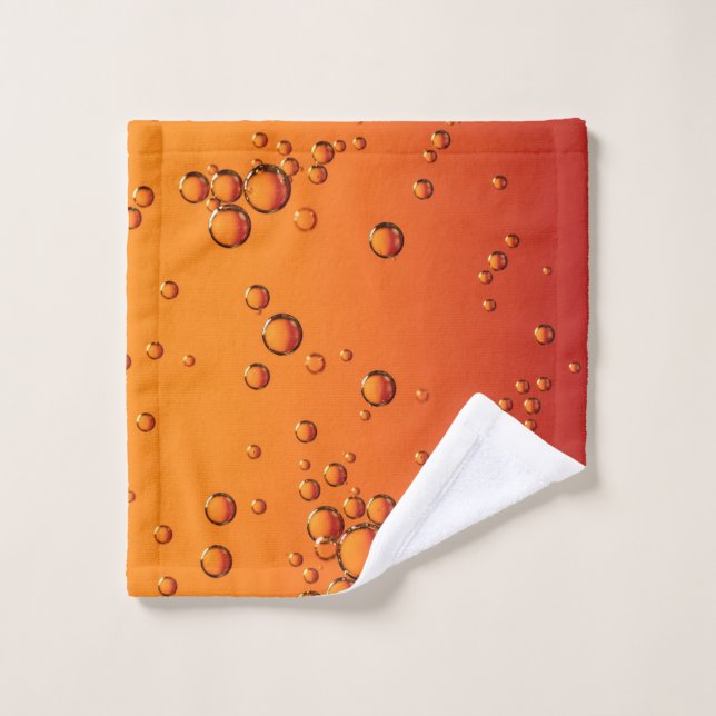 Gotas de agua en la superficie naranja (Toallita)
