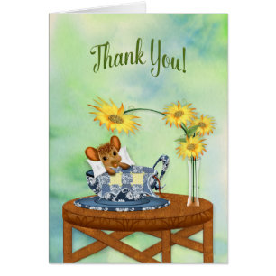 Gracias - ratón en la reclinación de la taza de té