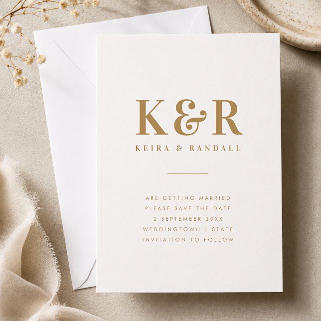 Guardar la Fecha | Anuncio de Boda con Monograma D (Gold monogram save the date card with couple initials, names, date, and location details.)