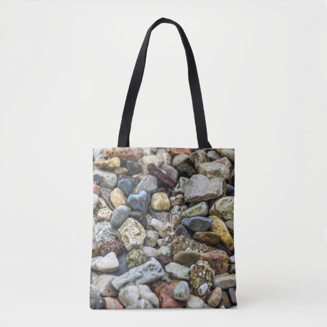 Guijarros en una bolsa de asas de la playa (Anverso)