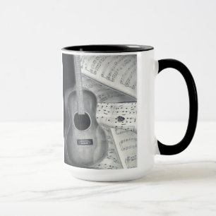 Guitarra y taza de la partitura