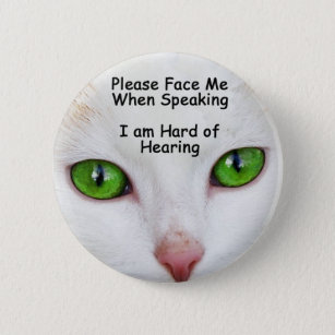 Hágame frente por favor los ojos de gato del botón