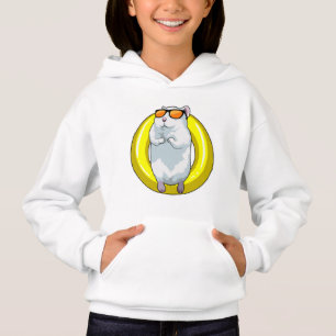 Hamster en Natación con anillo de natación