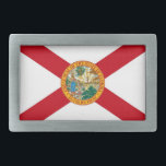Hebilla de cinturón con bandera del estado de Flor<br><div class="desc">Celebra el Sunshine State con esta elegante hebilla de cinturón con la bandera de Florida. Esta hebilla de cinturón, elaborada a partir de materiales duraderos, muestra los elementos icónicos de la bandera del estado de Florida, incluido el sello de estado fijado contra una ensalada roja sobre un fondo blanco. Perfecto...</div>