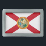 Hebilla de cinturón con bandera del estado de Flor<br><div class="desc">Celebra el Sunshine State con esta elegante hebilla de cinturón con la bandera de Florida. Esta hebilla de cinturón, elaborada a partir de materiales duraderos, muestra los elementos icónicos de la bandera del estado de Florida, incluido el sello de estado fijado contra una ensalada roja sobre un fondo blanco. Perfecto...</div>