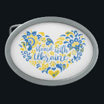 Hebilla De Cinturón Oval Apoyar a Ucrania con letras y corazón<br><div class="desc">Apoyen a Ucrania con letras y corazón con los colores de la bandera ucraniana y un patrón étnico transparente ilustracion de arte popular y letras en los colores de la bandera ucraniana y patrón étnico corazón, forma, pureza, leyenda, signo de paz, símbolo de paz, paz, no guerra, paro la guerra,...</div>