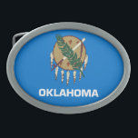 HEBILLA DE CINTURÓN OVAL BANDERA ESTATAL DE OKLAHOMA<br><div class="desc">La bandera del estado de Oklahoma consiste en un tradicional escudo de piel de búfalo de la Nación Osage con siete plumas de águila en un campo azul cielo de Choctaw.</div>