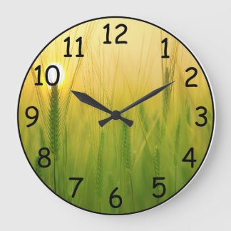Hermoso amanecer en un reloj de pared de campo de 
