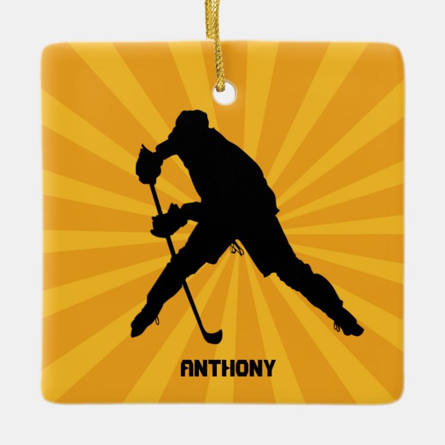 Hockey sobre silueta con adorno navideño amarillo (Anverso)