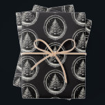 Hoja De Papel De Regalo Black Christmas Tree Vintage<br><div class="desc">Envuelve tus regalos con una elegancia festiva morosa con este inolvidable conjunto de sábanas de papel de envoltura negra, con un impresionante patrón repetido de árboles de Navidad enmarcado en fronteras ornamentales de inspiración vintage. Diseñado para dar un giro gótico y audaz a la entrega de regalos de los Navidades...</div>