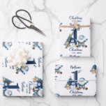 Hoja De Papel De Regalo Blue Boy First Christmas<br><div class="desc">Celebra la primera Navidad de un bebé al estilo con papel de envoltura personalizado que es tan único como lo son! Este papel de envolvimiento de fabricación personalizado es perfecto para añadir un toque personal a los regalos para los más pequeños y sus familias. Diseñado con colores festivos, adorables iconos...</div>