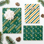 Hoja De Papel De Regalo Merry Christmas Custom Name Monograma Green Gold<br><div class="desc">Eleva tu regalo para esta temporada de vacaciones con un conjunto de diseños muy bien coordinados! Con tres patrones únicos en colores coincidentes, que se pueden usar individualmente o como conjunto. La primera hoja se personaliza con el nombre del destinatario en letras clásicas de estilo bloque. La frase 'Feliz Navidad'...</div>