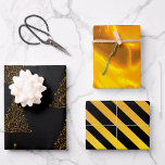 Hoja De Papel De Regalo Navidades de oro y negro<br><div class="desc">Este juego de papel envuelto de Navidades dorados y negros presenta un patrón de árboles de Navidad metálicos dorados todo sobre negro en la primera hoja, un patrón de giro dorado muy colorido y vívido en la segunda hoja, y de acuerdo con el tema negro y oro, un patrón de...</div>