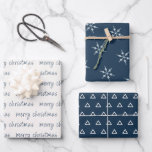 Hoja De Papel De Regalo Rustic Blue Ivory Merry Christmas Snflake<br><div class="desc">Conjunto rústico de tres hojas de papel de envoltura coordinadas en una paleta de color azul y marfil. Uno tiene la Feliz Navidad escrita a mano en un moderno tipo de letra. El segundo presenta un patrón abstracto de árbol de Navidad y la tercera hoja tiene un patrón de copos...</div>